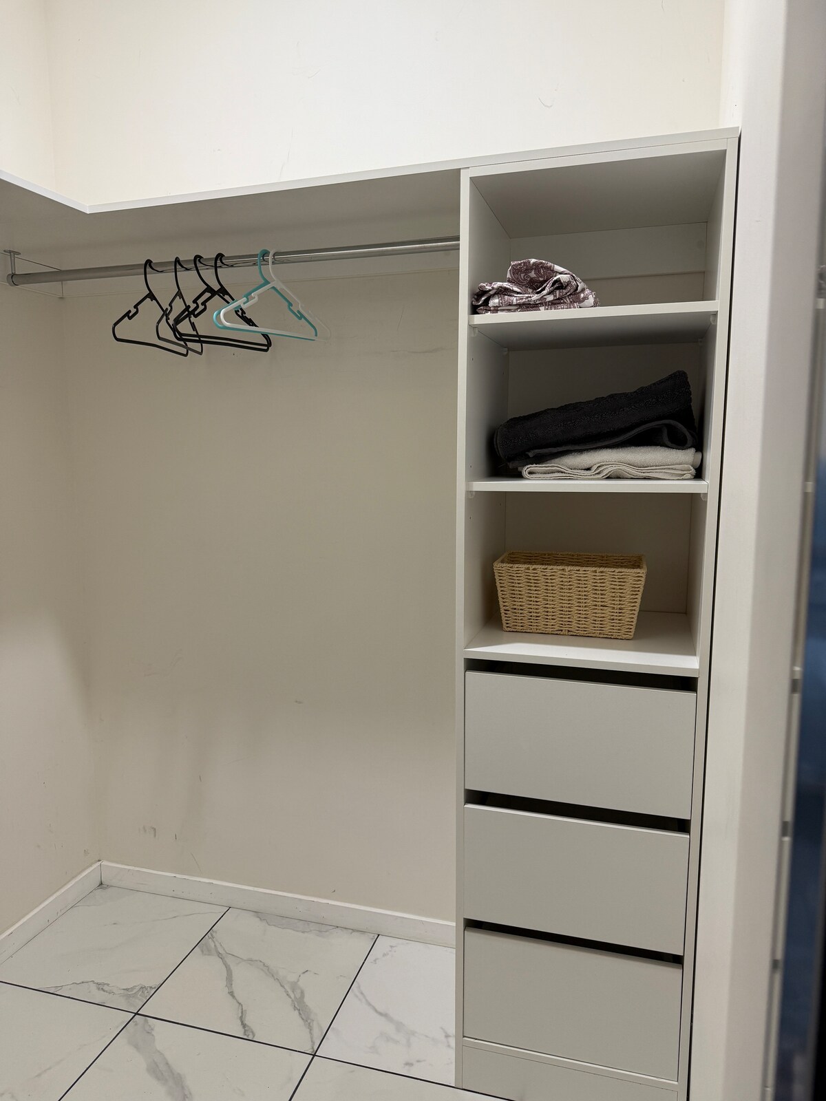 Walk-in wardrobe with drawers and shelving at Luxe Nest, 33 Maya Avenue