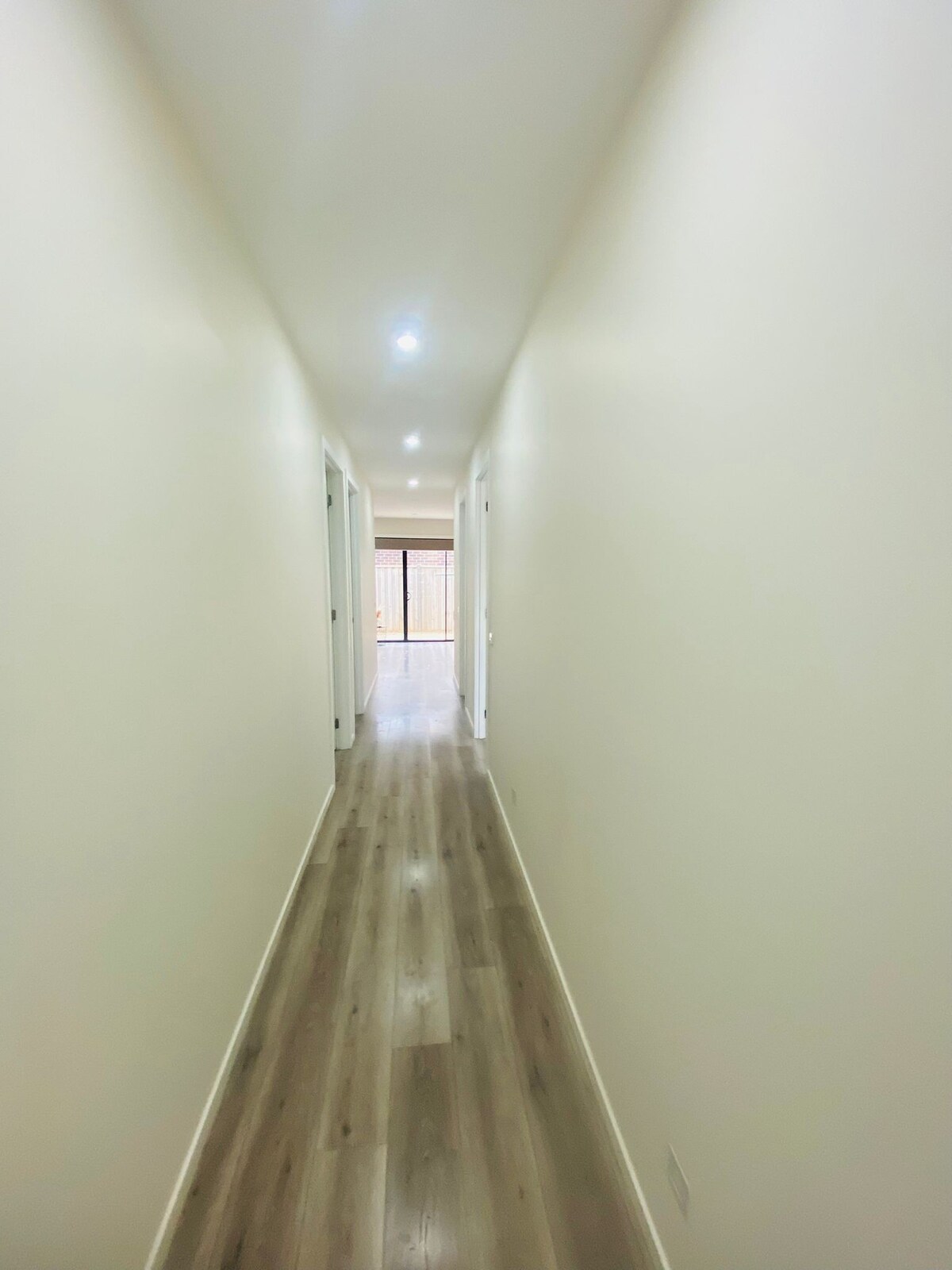 Long central hallway at Luxe Nest, 33 Maya Avenue