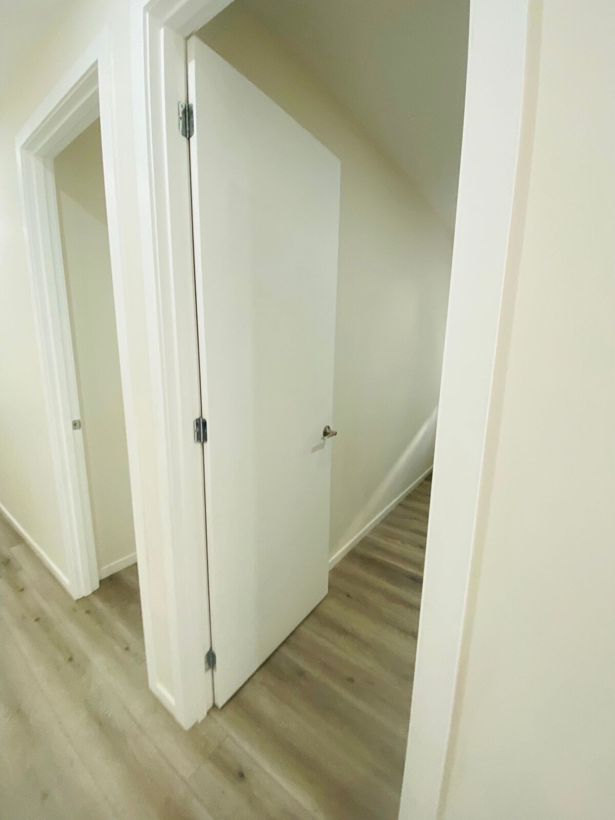 Hallway with linen cupboards at Luxe Nest, 33 Maya Avenue